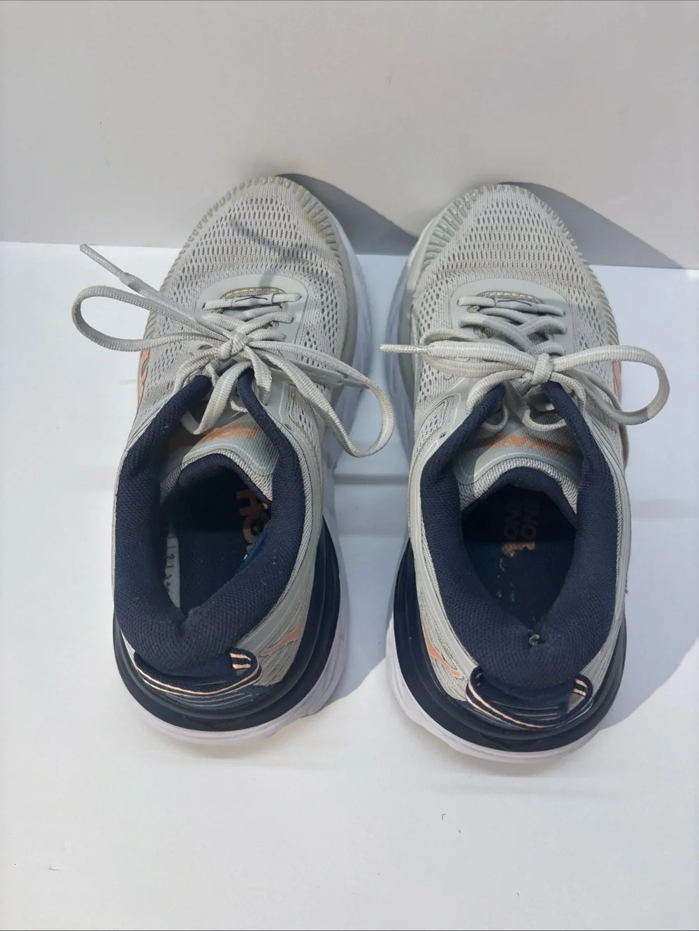 Hoka women’s size 7 gray/peach Bindi 7 style #110531 LRBI in fair condition.